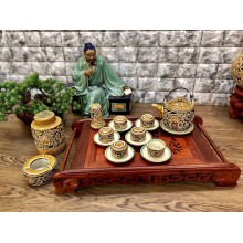 Bộ trà Bát Tràng khắc nổi hoa mẫu đơn dáng vại quai đồng